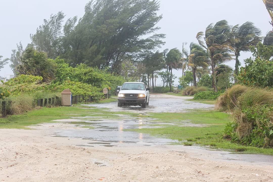 A car on the road as a hurricane passes over Florida.